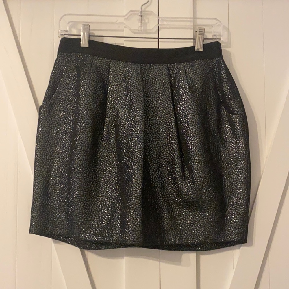 Barely worn, mini skirt with fun back detail